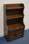 A DARK ERCOL ELM WATERFALL OPEN BOOKCASE, width 61cm x depth 33cm x height 111cm