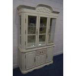 A CONTINENTAL CREAM FINISH DISPLAY CABINET, with two glass shelves, width 136cm x depth 41cm x