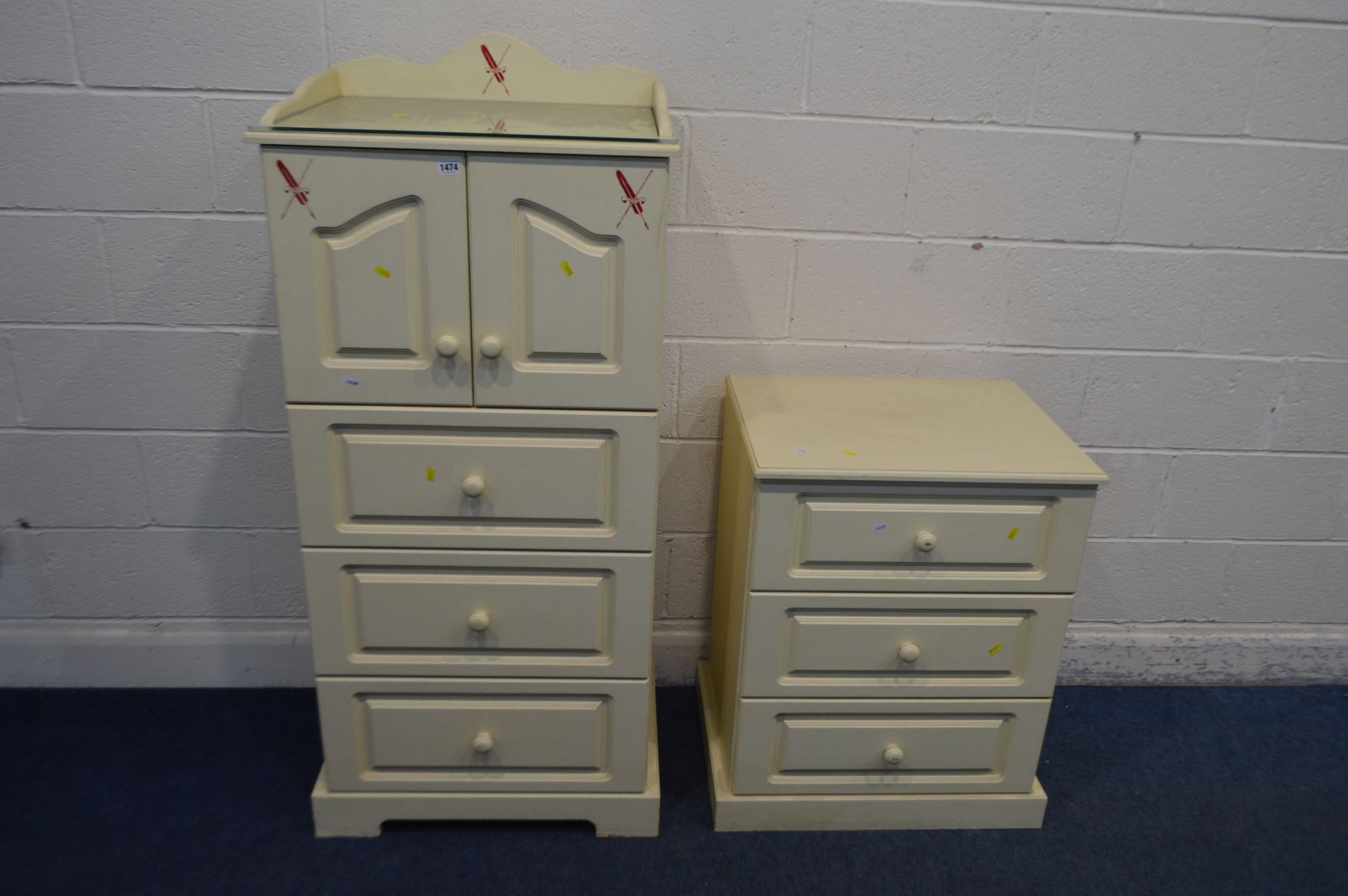 A MODERN TWO PIECE BABY CHANGING STORAGE CABINET, with double cupboard doors enclosing a slide,