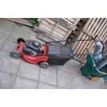 A MOUNTFIELD RS100 PETROL LAWN MOWER with grass box (engine pull freely but hasn't been started)