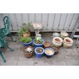 A TERRACOTTA HERB POT, seven glazed plant pots, four composite plant pots and a Cherub Bird Bath