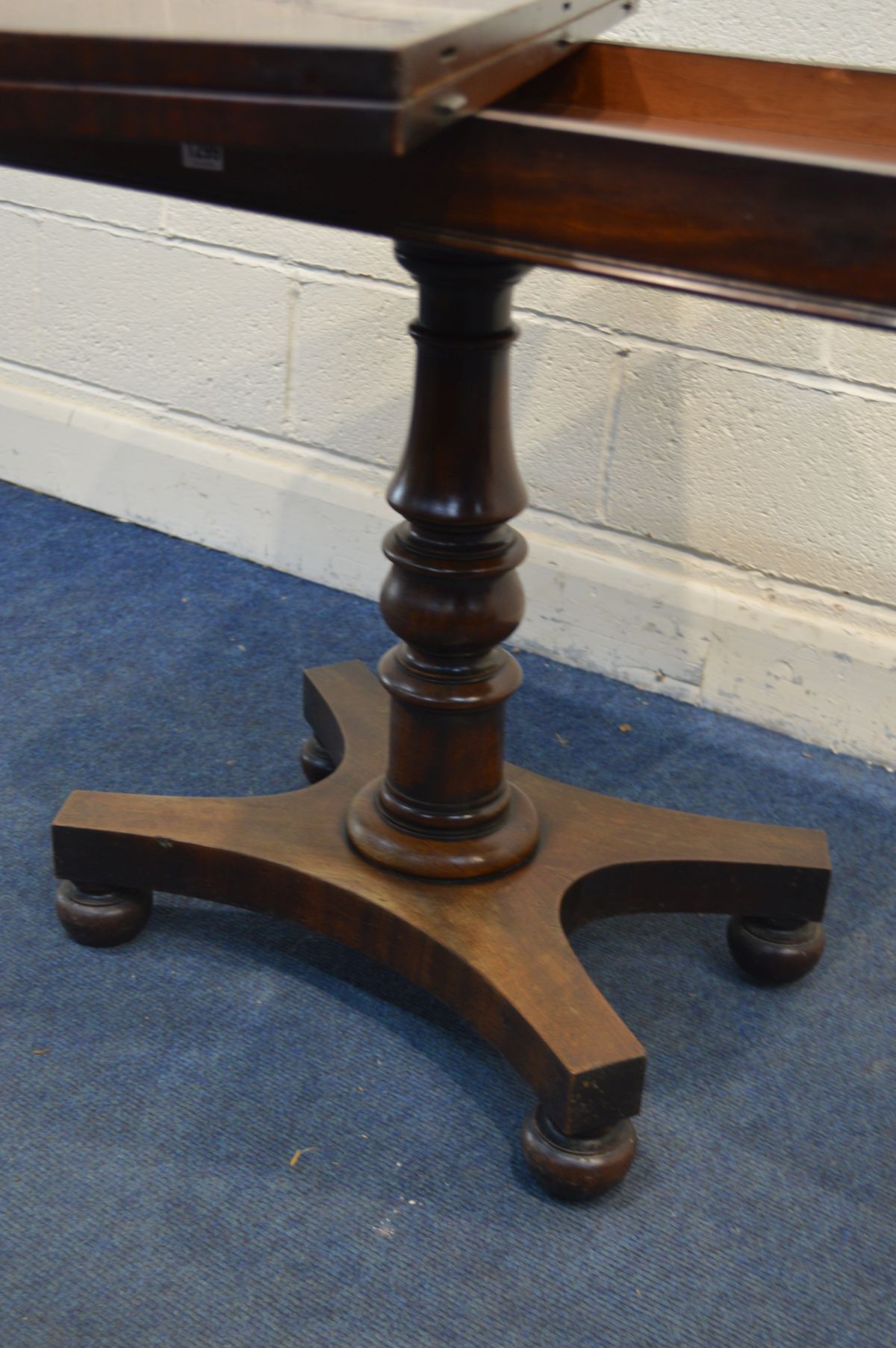 A VICTORIAN MAHOGANY CARD TABLE, the fold over top enclosing a green baize lining, on a single - Image 3 of 3