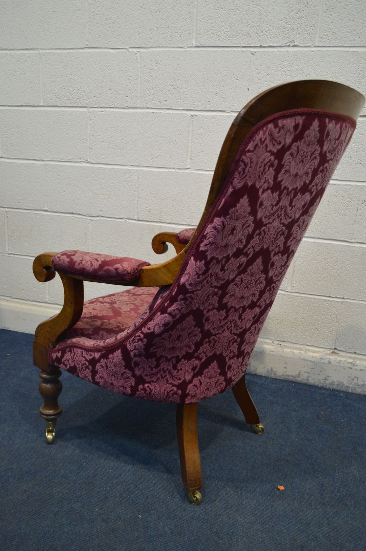 A VICTORIAN WALNUT OPEN ARMCHAIR with scrolled armrests, on turned front legs and brass casters, - Image 3 of 4
