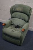 A CELEBRITY GREEN ELECTRIC RECLINING ARMCHAIR, with instructions (upholstery faded to head rest) (