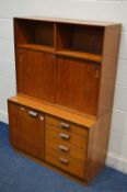 A MID 20TH CENTURY TEAK BOOKCASE with sliding doors, open shelves and four drawers, width 92cm x