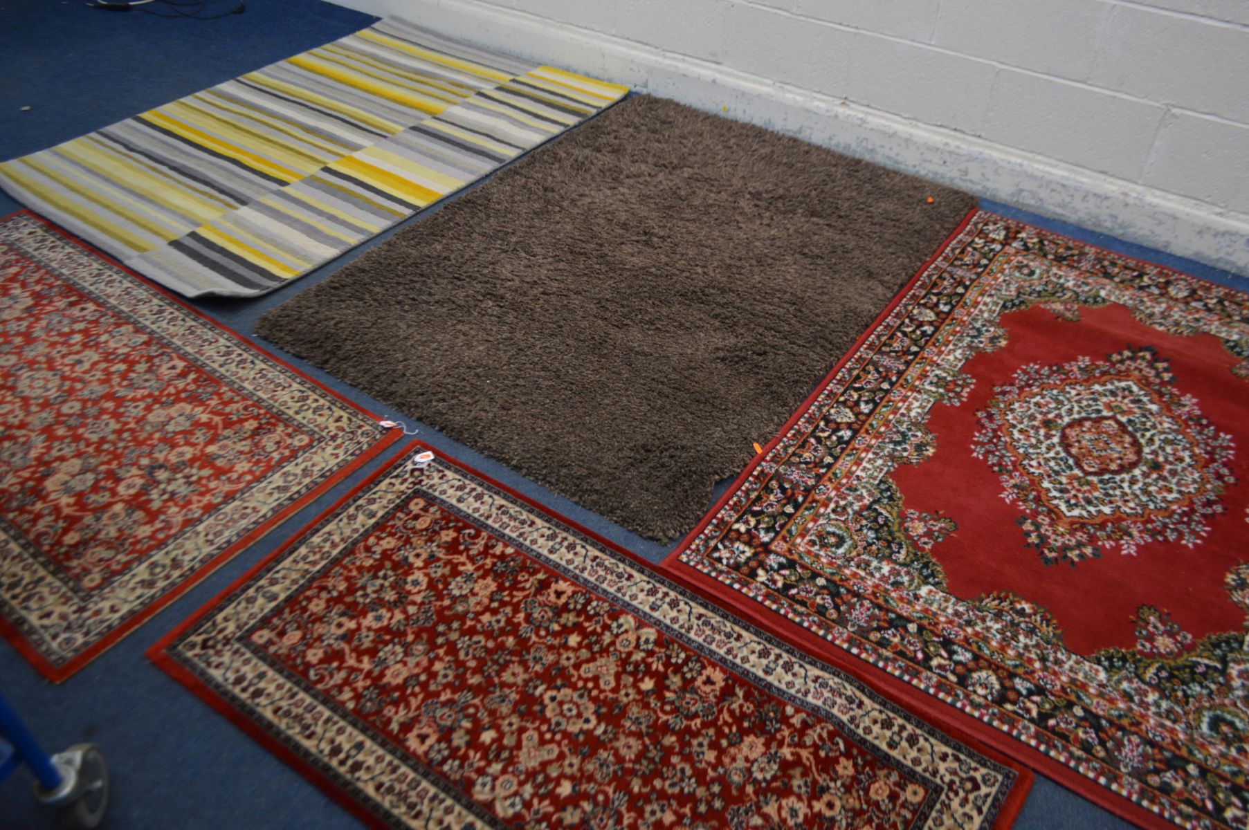 TWO MODERN RUGS, to include one stripped, largest size 170cm x 126cm and a red floral rug and a pair