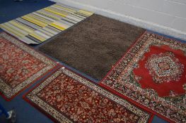 TWO MODERN RUGS, to include one stripped, largest size 170cm x 126cm and a red floral rug and a pair