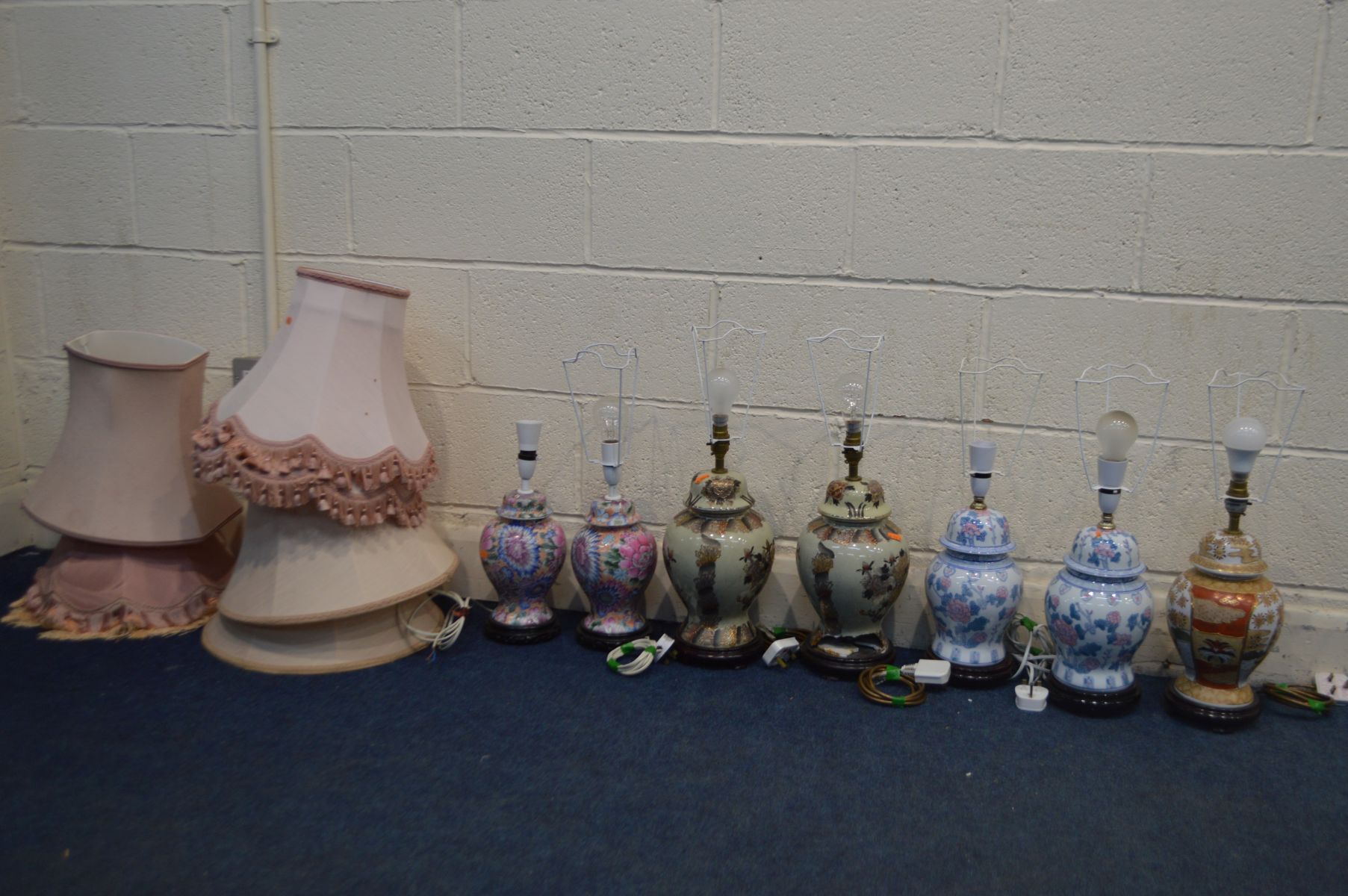 THREE PAIRS OF CERMAIC ORIENTAL STYLE TABLE LAMPS, another similar table lamp, all with shades (