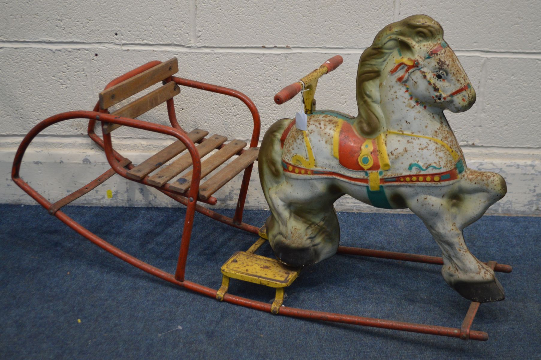 A VINTAGE MOBO CHILDS ROCKING HORSE, with slatted seat