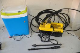 A KARCHER 695 PRESSURE WASHER with lance and two attachments (one attachment cracked) together