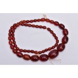 A CHERRY AMBER STYLE BAKERLITE BEADED NECKLACE, graduated beads, largest bead measuring 28.4mm x