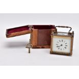 A SMALL LEATHER CASED BRASS TRAVEL CARRIAGE CLOCK, glass panels, white dial with roman numerals,