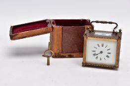 A SMALL LEATHER CASED BRASS TRAVEL CARRIAGE CLOCK, glass panels, white dial with roman numerals,