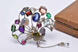 A WHITE METAL FLORAL SPRAY, GEM SET BROOCH, floral spray set with a variety of multi cut gemstones