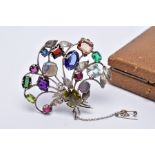 A WHITE METAL FLORAL SPRAY, GEM SET BROOCH, floral spray set with a variety of multi cut gemstones