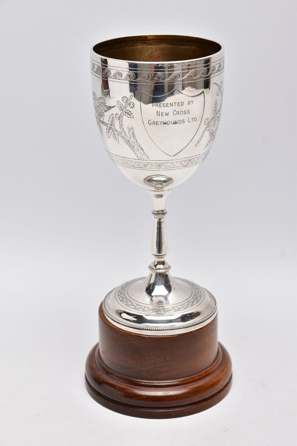 A LATE VICTORIAN SILVER TROPHY CUP, engraved foliate and bird design, engraved inscription '