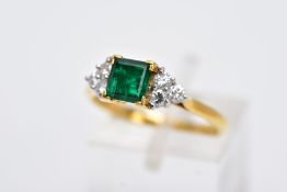 A LATE 20TH CENTURY 18CT GOLD EMERALD AND DIAMOND RING, centring on a square cut emerald measuring