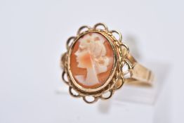 A 9CT GOLD CAMEO RING, oval form depicting a lady in profile, collet mount and scallop edge