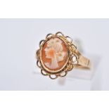 A 9CT GOLD CAMEO RING, oval form depicting a lady in profile, collet mount and scallop edge