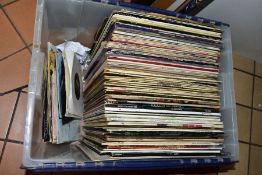 A PLASTIC BOX CONTAINING OVER ONE HUNDRED LPs, 12IN AND 7IN SINGLES including Rubber Soul (poor),