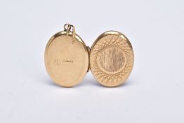 A 9CT GOLD OVAL LOCKET PENDANT, textured design with a vacant cartouche, fitted with a tapered