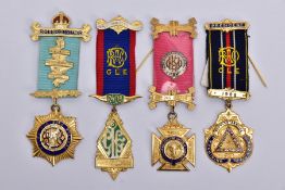 FOUR SILVER GILT, MASONIC MEDALS, of various designs decorated with blue, red, green and white