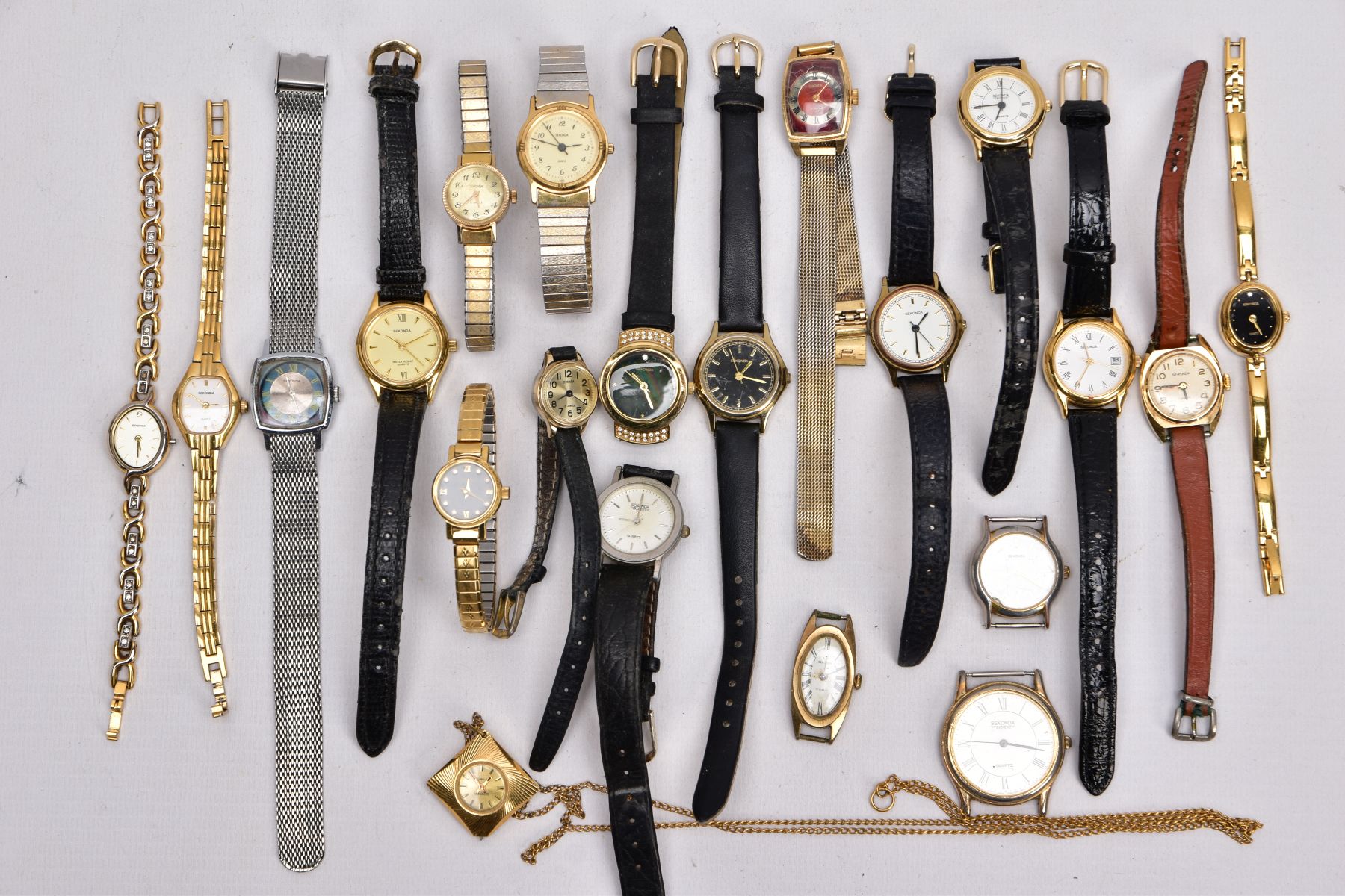 A BAG OF TWENTY 'SEKONDA' WRISTWATCHES AND A 'SEKONDA' WATCH FOB, mostly ladies quartz watches, of