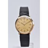 A 9CT GOLD OMEGA DE VILLE WRISTWATCH, hand wound movement, round gold dial signed 'Omega De