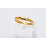 A 22CT GOLD WEDDING RING, measuring approximately 3mm in width, ring size N, ring slightly oval in