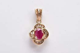 A 9CT GOLD RUBY AND DIAMOND PENDANT, centring on an oval cut ruby (possibly treated/synthetic),