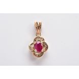 A 9CT GOLD RUBY AND DIAMOND PENDANT, centring on an oval cut ruby (possibly treated/synthetic),