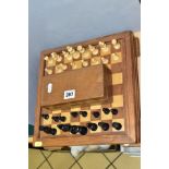 A MID 20TH CENTURY WOODEN CHESS BOARD AND CHESS PIECES, the board with lift off top opening to