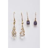 TWO PAIRS OF YELLOW METAL GEMSET DROP EARRINGS, the first pair suspending claw set, oval cut