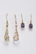 TWO PAIRS OF YELLOW METAL GEMSET DROP EARRINGS, the first pair suspending claw set, oval cut