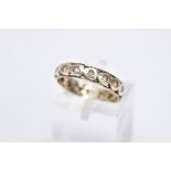 A 9CT GOLD FULL ETERNITY RING, set with colourless stones assessed as spinel, each within a heart