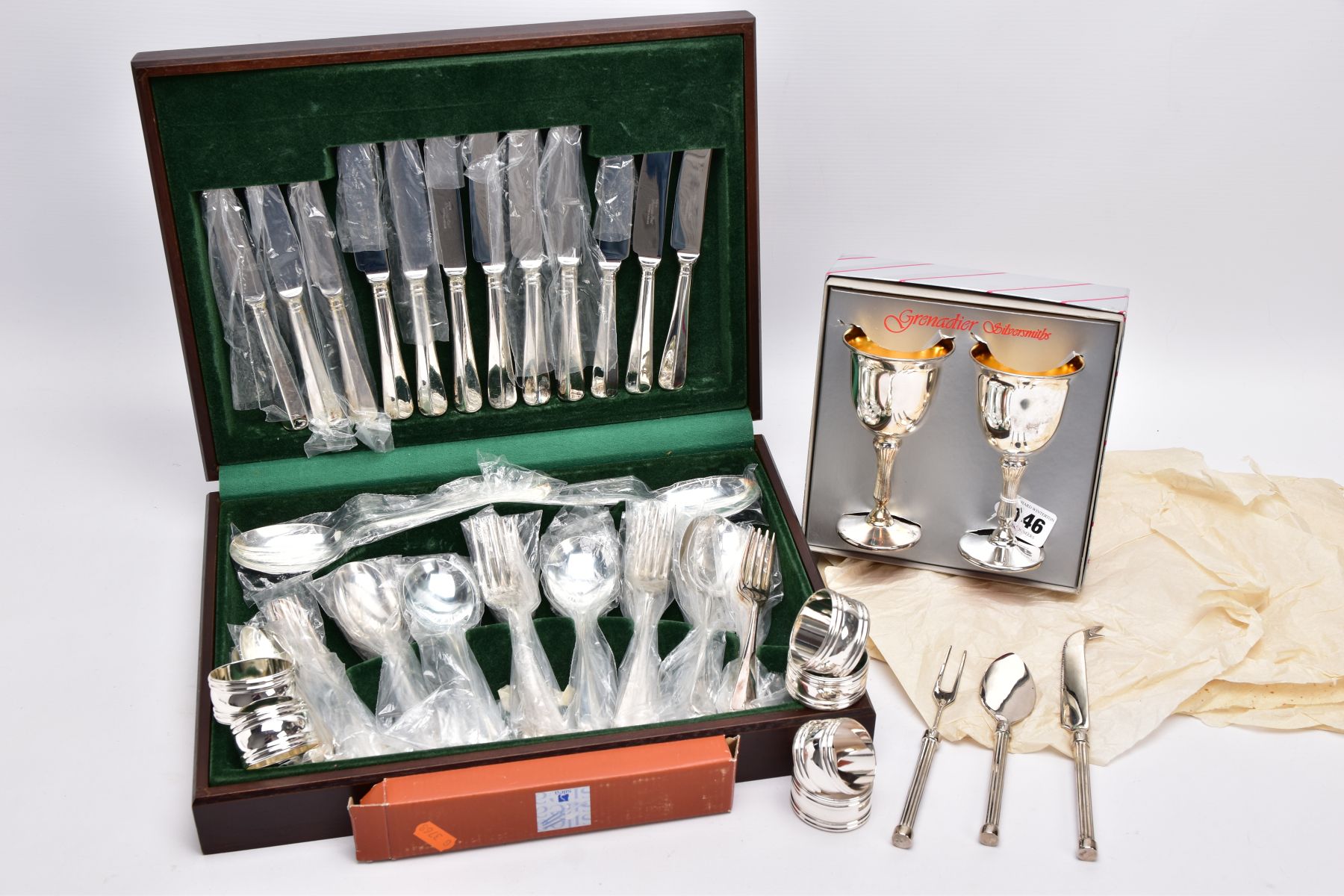 A COMPLETE CANTEEN OF CUTLERY, TWO GOBLETS, SIX NAPKIN RINGS AND A THREE PIECE CUTLERY SET, the