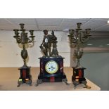 A LATE 19TH CENTURY BLACK SLATE, MARBLE AND BRONZED CLOCK GARNITURE, the clock with figural surmount