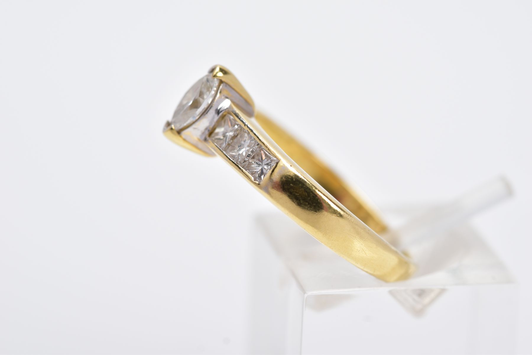 A YELLOW METAL DIAMOND RING, designed with a central raised, marquise cut diamond, flanked with - Image 2 of 4