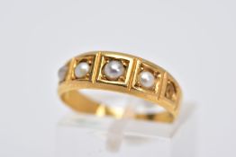 A YELLOW METAL CULTURED PEARL RING, designed with a five square section, three set with cultured