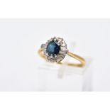 A LATE 20TH CENTURY 18CT GOLD SAPPHIRE AND DIAMOND OVAL CLUSTER RING, centring on a mixed cut