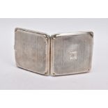 A SILVER CIGARETTE CASE, of an engine turn design, engraved monogram, missing elastic straps on