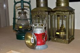 TWO PARAFFIN/OIL STORM LANTERNS, both use 1 inch wicks, approximate height 39cm, together with a