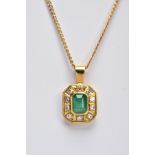 AN EMERALD AND DIAMOND PENDANT AND CHAIN, hexagonal shaped pendant centring on an emerald cut
