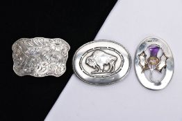 THREE BELT BUCKLES, to include an AF silver oval buckle depicting a thistle, with missing mother