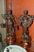 A PAIR OF BRONZED SPELTER FIGURES, the first depicts a female carrying grapes and vine titled
