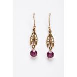 A PAIR OF EDWARDAN, GARNET AND SPLIT PEARL DROP EARRINGS, each yellow metal earring, set with a