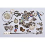 A BAG OF ASSORTED JEWELLERY, to include a white metal charm bracelet, suspending thirty-two white