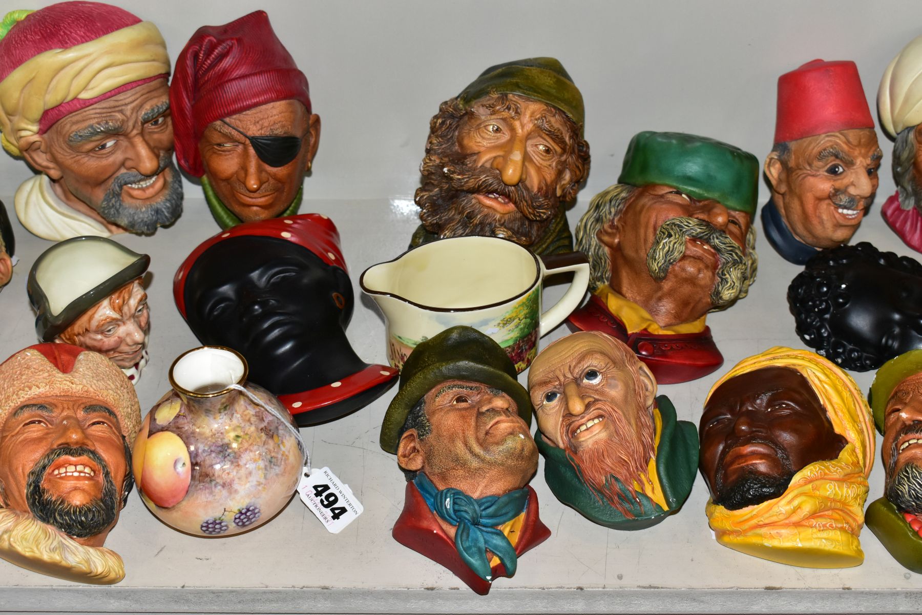 VARIOUS BOSSONS HEAD PLAQUES AND OTHER CERAMICS, to include Dunheved bud vase, handpainted fruit