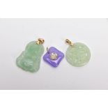 THREE JADE PENDANTS, the first a carved Buddha, fitted with a tapered bail, stamped '14k', the