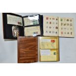 EPHEMERA AND POSTAL HISTORY, three albums containing an unusual collection of Arms and Crests,